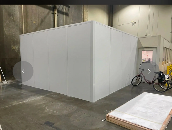 A modular office solutions expansion of a prefab modular room by SoFlo inside an industrial setting