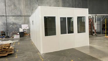 A prefabricated modular office with windows.