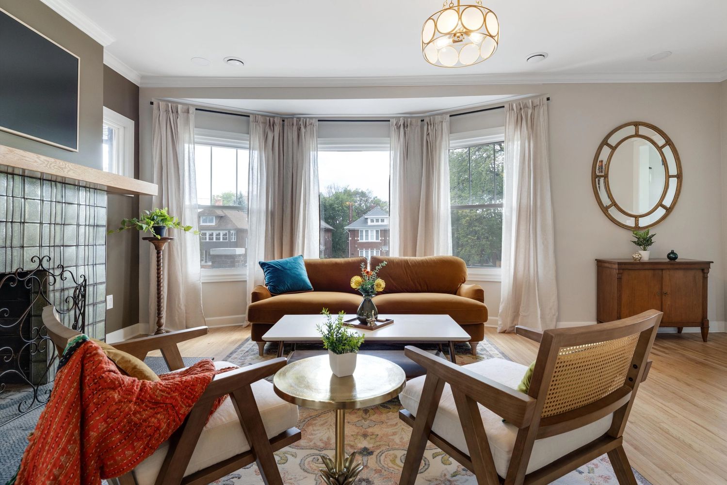 Cozy living room with mid-century modern furniture and natural light.