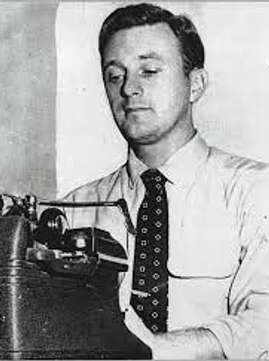 Young John Seigethaler at the typewriter 