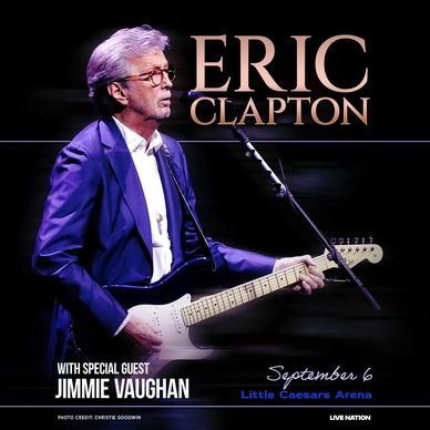 Eric Clapton performing live with guitar.