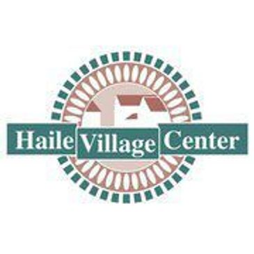 Logo of Haile Village Center with a house icon and decorative circular border.