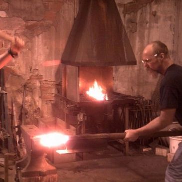 Forging Iron with son.  Randy and James Kiser