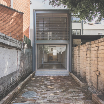 An architectural renovation of an old 1800's inner city terrace. Shows steel windows 