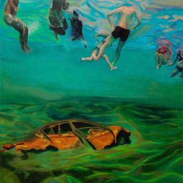 Underwater scene with people swimming above a submerged rusty car.