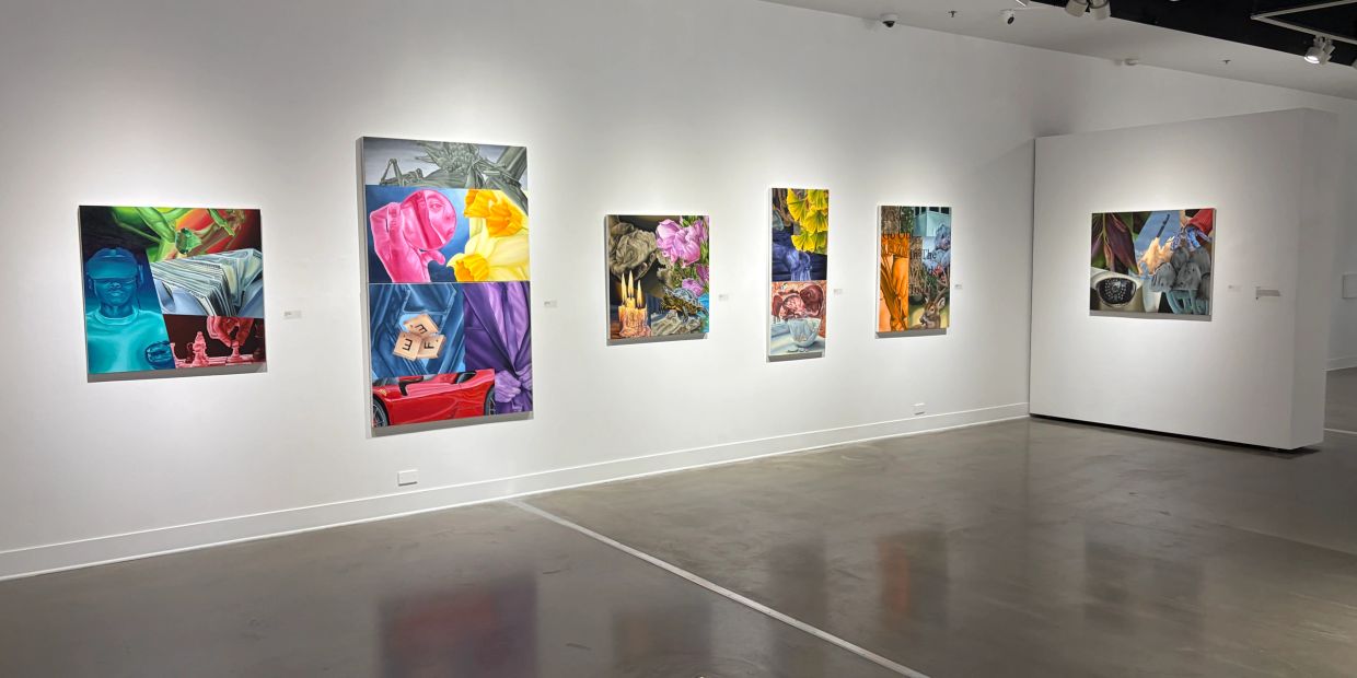 A contemporary art gallery with colorful, surreal paintings displayed on white walls.