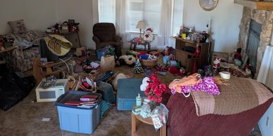 Before full-service junk removal by Mohave County Clean Outs showing a cluttered home prior to furni