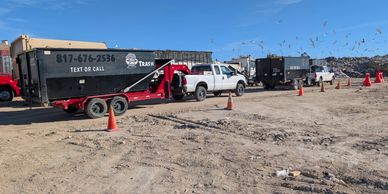 Both trucks and trailers waiting in the landfill line! We dispose properly 