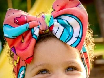 baby head wrap. made from stretch rayon. comfortable and bright way to keep those strands out of eye