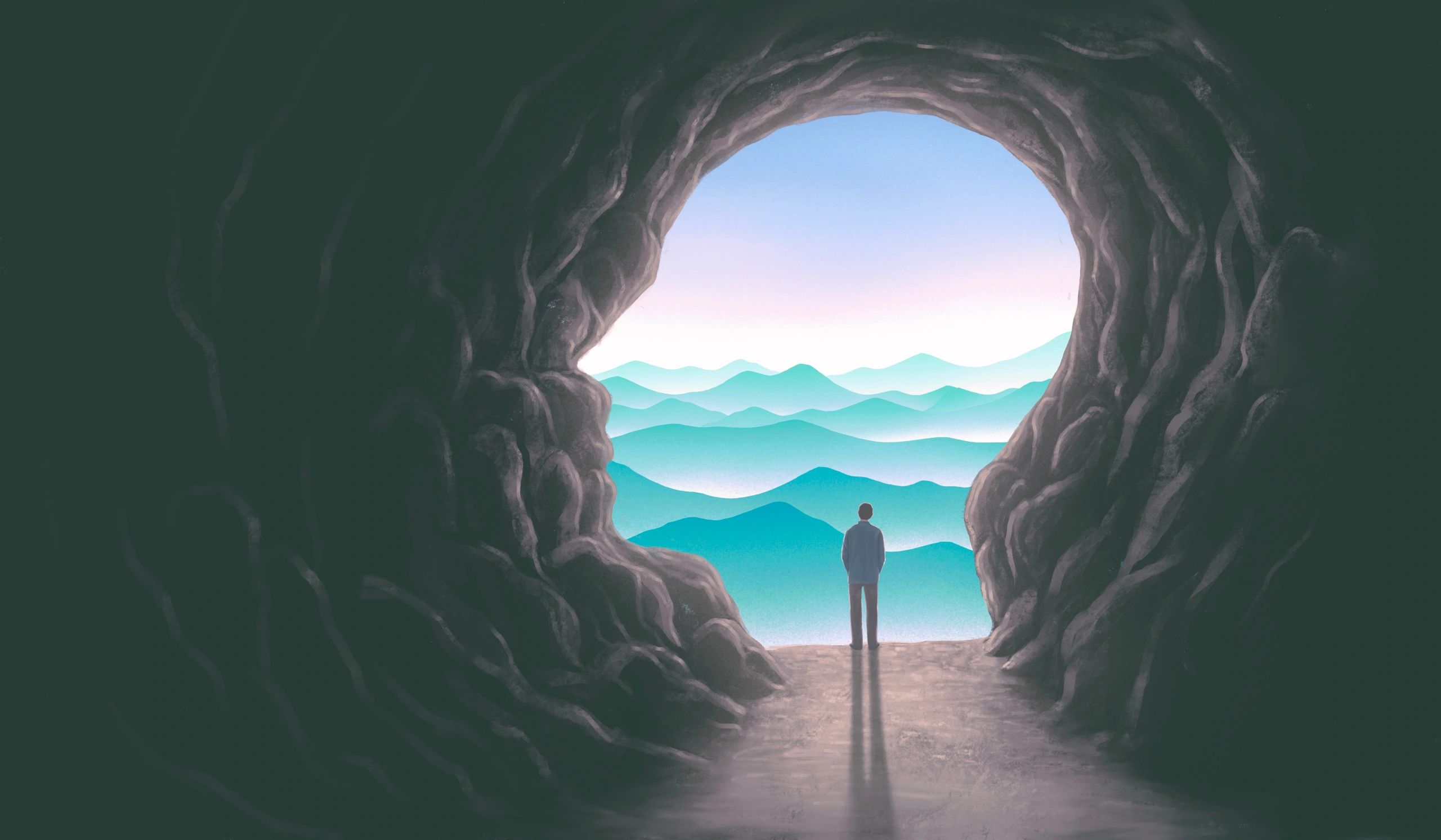 A lone figure stands at a cave entrance overlooking misty mountain layers.