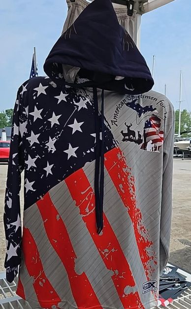 Show your American pride with this bold pullover hoodie featuring a distressed American flag design 