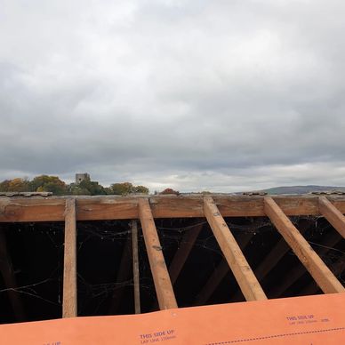 Roof Repair and Clitheroe Castle int he background