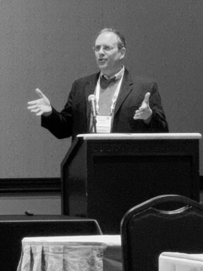 Dr. Parker Garrett speaking at a conference