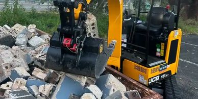 Would you like an excavator with that skip bin?