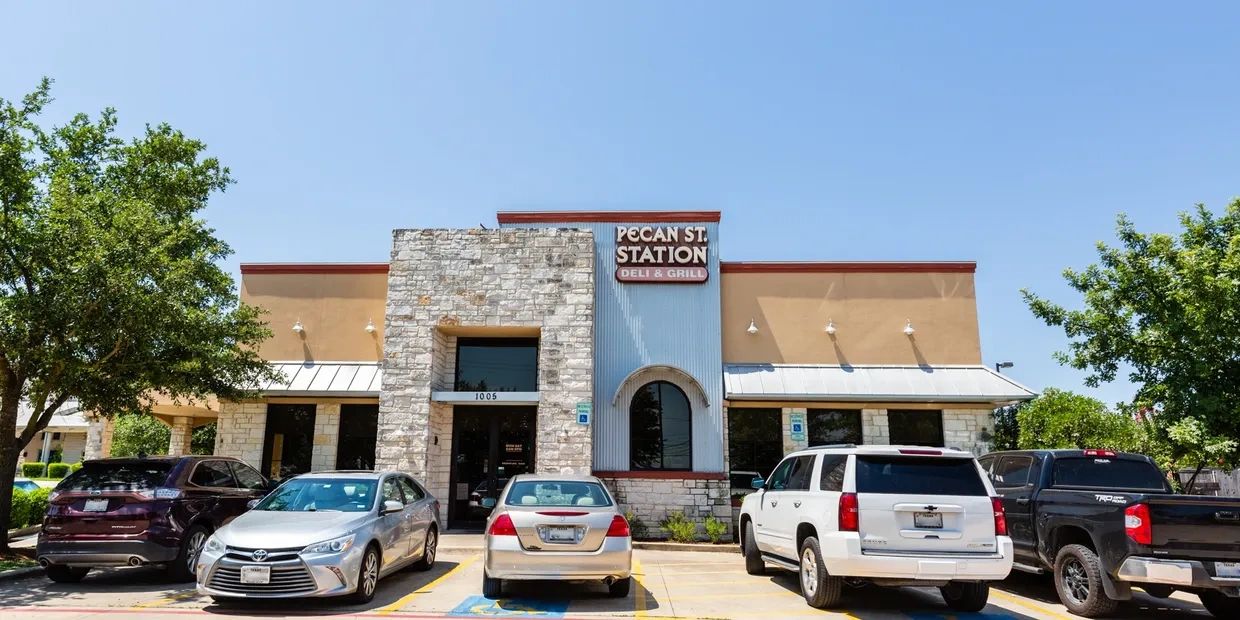 A picture of the car parking outside the pecan station