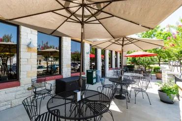 A picture of the vacant chairs and tables outdoor