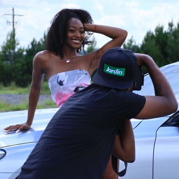 Model doing a music video shoot with a videographer.