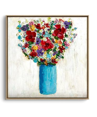 Colorful bouquet of flowers in a blue vase on a white background.