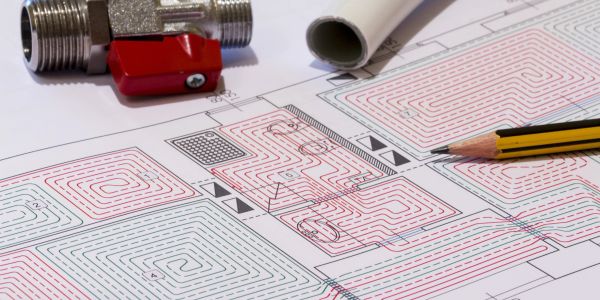 Heating system blueprint with a valve and pencil on top.