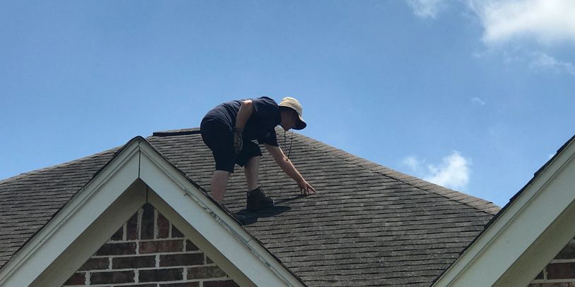Keystone Contracting Group inspecting shingle roof for Hail damage