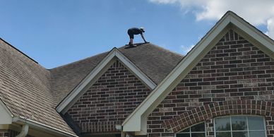 Keystone Contacting Group inspecting roof after a hail storm in Houston