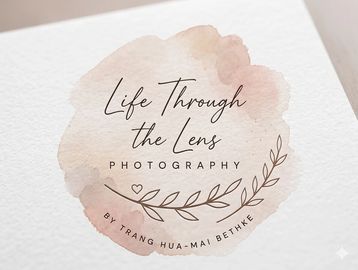 Elegant photography logo with watercolor background and delicate leaf design.