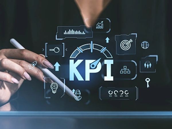 Hand interacting with KPI digital interface showing performance metrics.