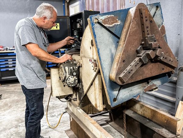 Welding positioner being repaired.