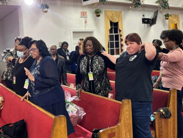 People praying together in a church.