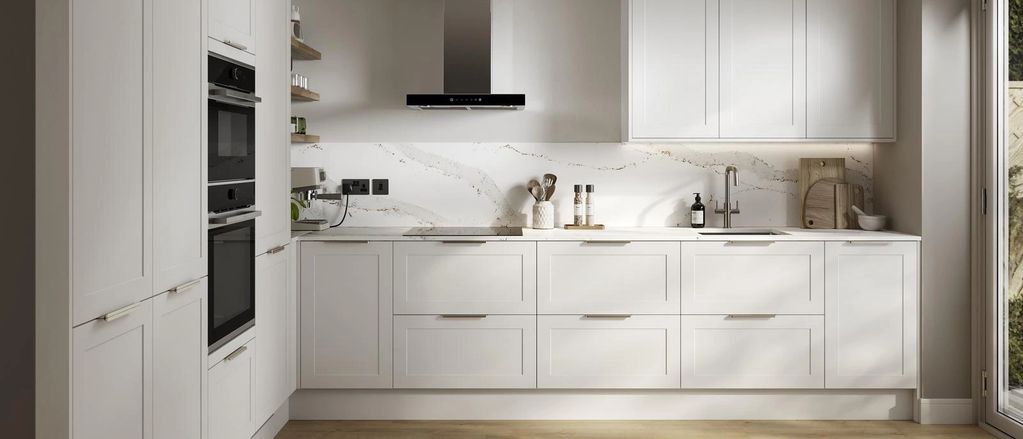 Morning white Milano shaker style kitchen with white marble top and backsplash