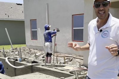 Dan Tripoli of Umbare Pools beside a new gunite pool shell