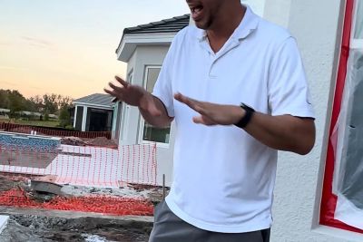 Dan Tripoli of Umbare Pools on a custom pool job site on coping and tile day