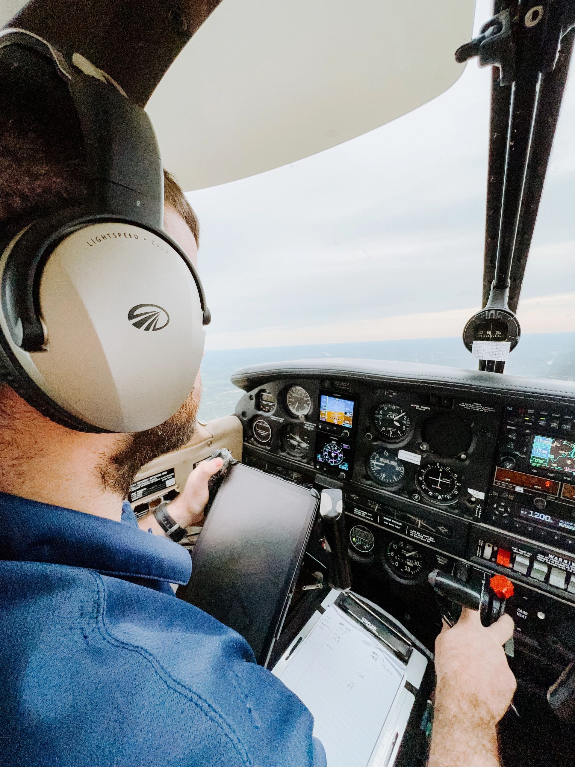 a pilot in the cockpit of an aircraft