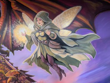 A fantasy fairy with glowing wings and hooded cloak hovers near a dragon.