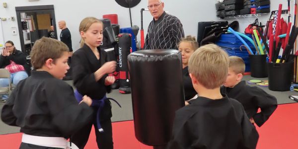 Kids learning karate on the display