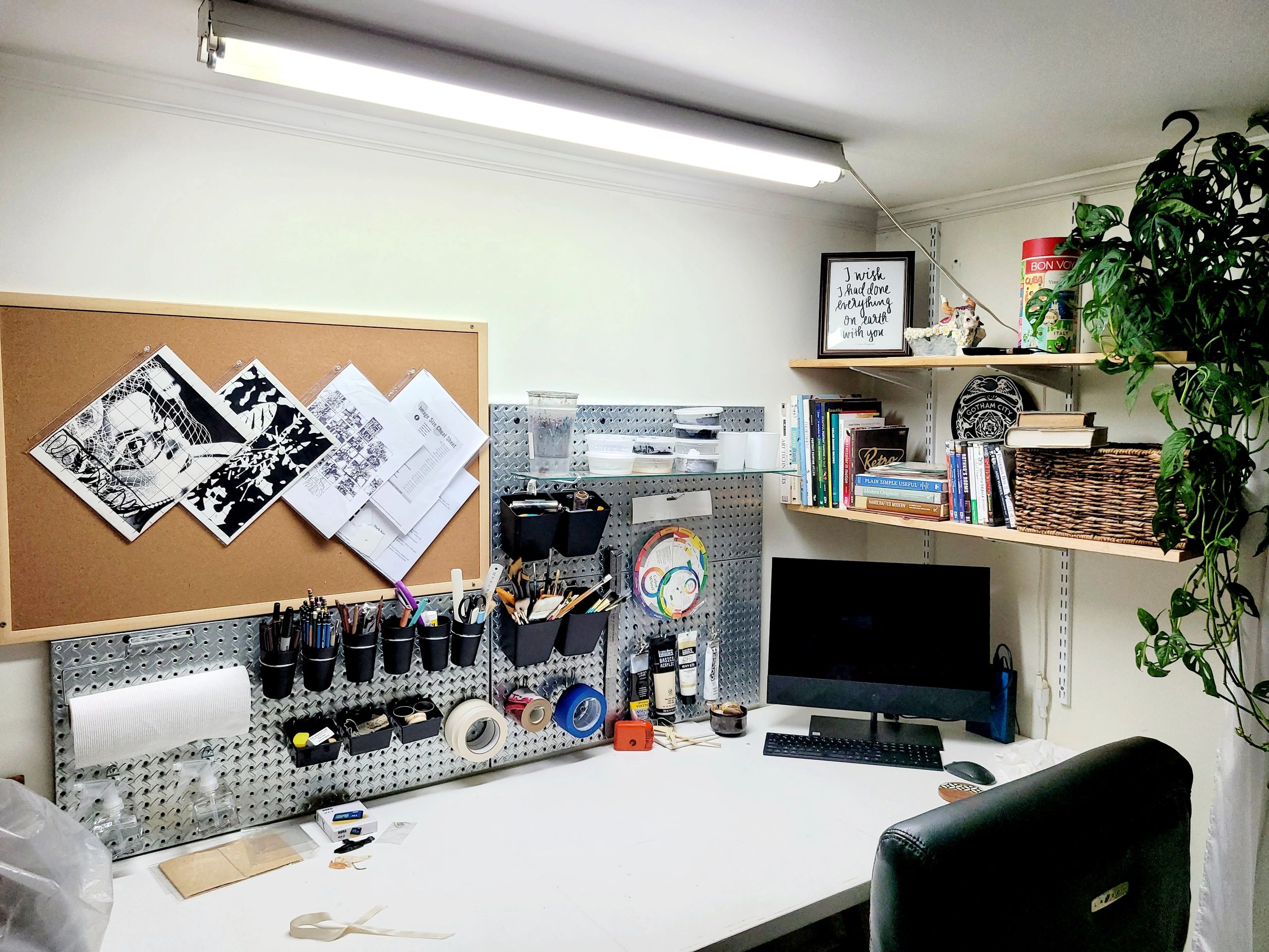 Artist Jeanne Burris Johnson’s studio workspace, featuring works in progress, materials, and tools o