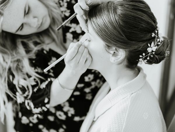 bride having her makeup applied