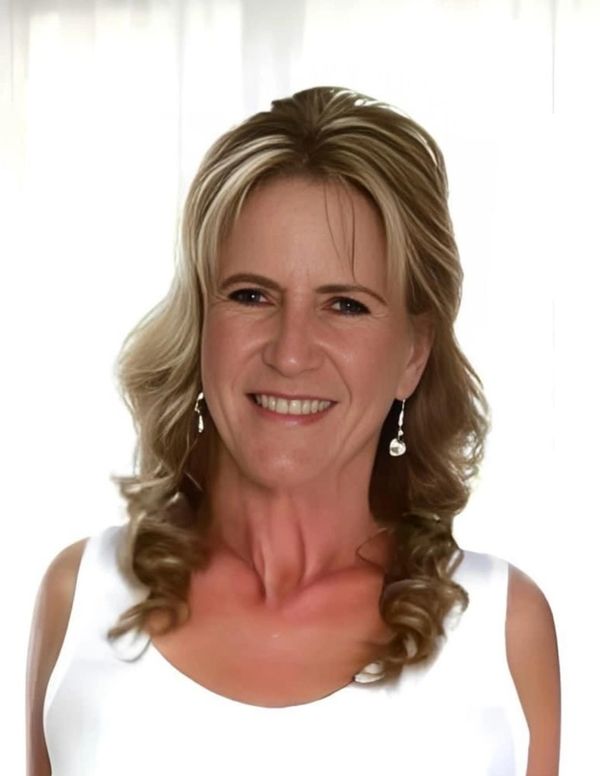 A woman smiling with looking ahead