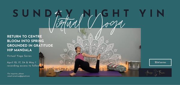 Woman practicing virtual Sunday night yin yoga with candles and cushions.
