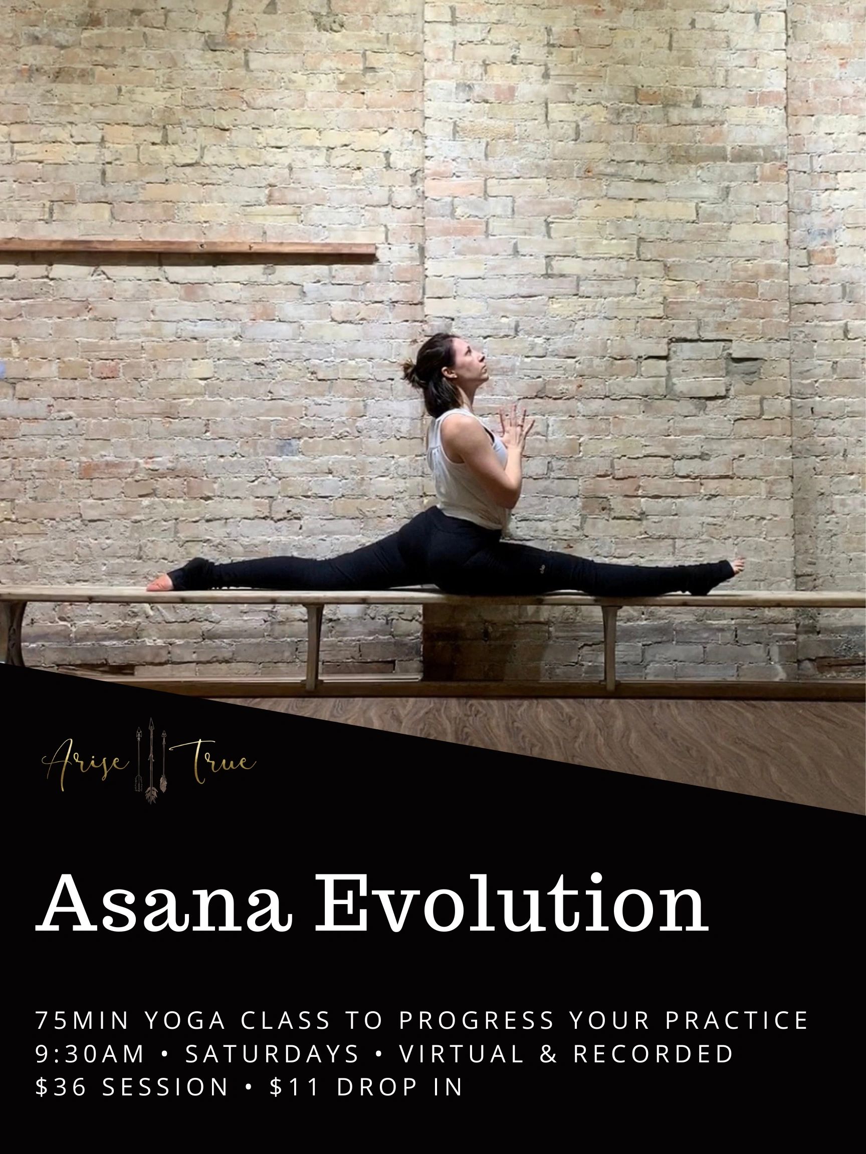 Woman practicing yoga splits indoors against a brick wall backdrop.