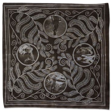 Black scarf with white fern design and circular vintage photos.