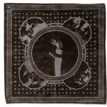 A cloth with vintage photograph prints in circular frames.