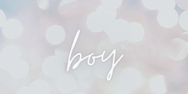 The word 'boy' on a soft blurred background.