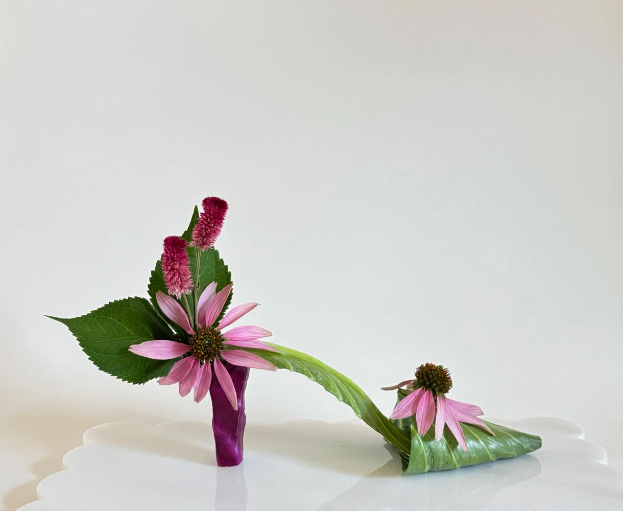 Delicate closed toe mule created with cabbage, cone flower and hydrangea leaves.