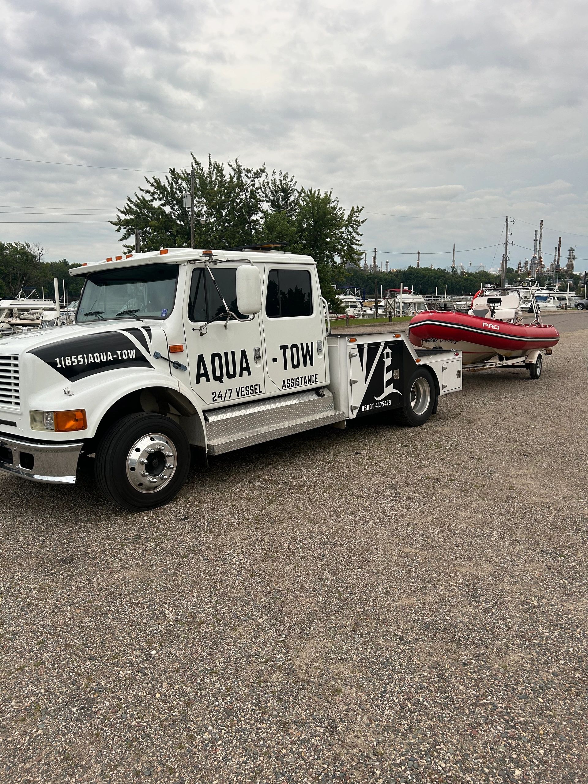 Aqua-Tow Truck with towboat in tow ready to help on any body of water