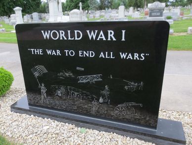 Memorial stone dedicated to World War I, labeled "The War to End All Wars."