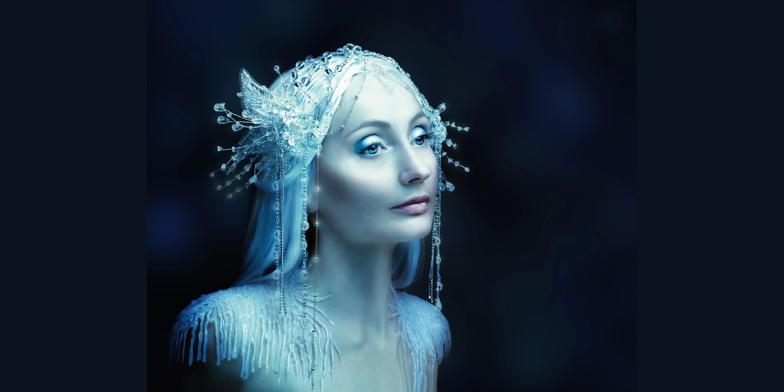 Studio portrait of a young woman representing a fantasy frosty elfin character with intricate hair
