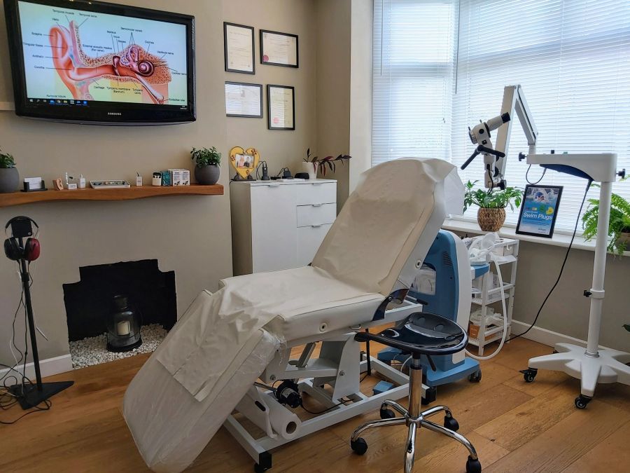 The treatment room at mi Ears Audiology in Knaphill, with the ENT microscope beside the chair