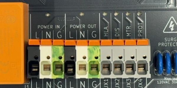 Close-up of labeled electrical connectors on a circuit board.