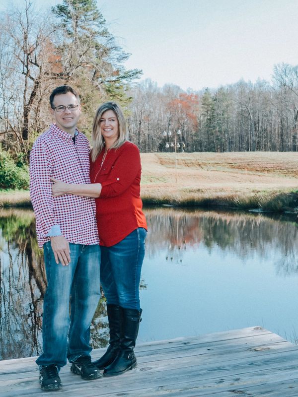 Jonathan & Tammy Bousman enjoying a beautiful day by the lake on their property, Blooming Acres Farm